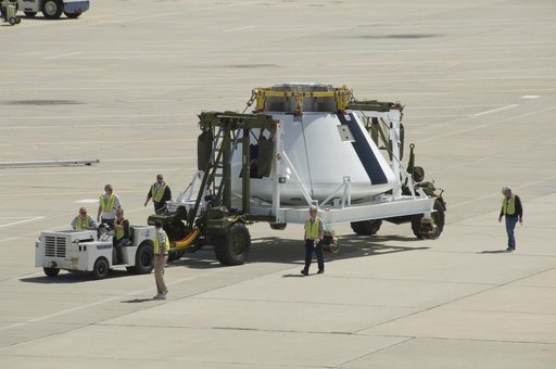 NASA Dryden Flight Research Center personnel accompany NASA's first Orion full-scale abort flight test crew module as it heads to its new home.