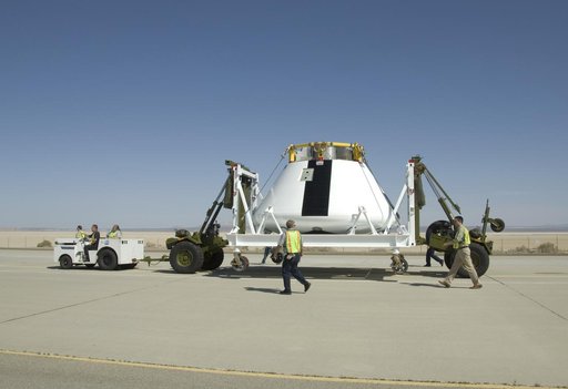 NASA Dryden Flight Research Center personnel accompany NASA's first Orion full-scale abort flight test crew module as it heads to its new home.