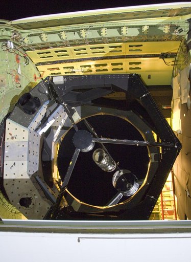 he SOFIA airborne observatory's 2.5-meter infrared telescope peers out from its cavity in the SOFIA rear fuselage during nighttime line operations testing
