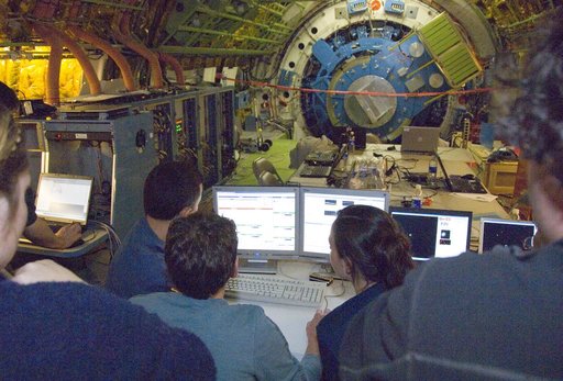 Scientists carefully examine data being received during nighttime line operations testing of the SOFIA airborne observatory's 2.5-meter infrared telescope