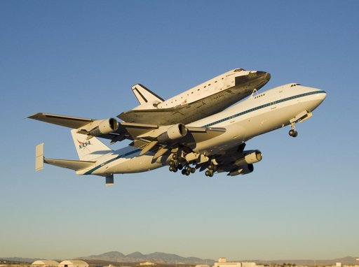 The modified 747 carrier aircraft carrying the Space Shuttle Endeavour soars aloft from Edwards AFB on the first leg of its ferry flight back to Florida