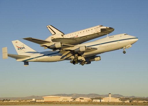 The modified 747 carrier aircraft carrying the Space Shuttle Endeavour soars aloft from Edwards AFB on the first leg of its ferry flight back to Florida