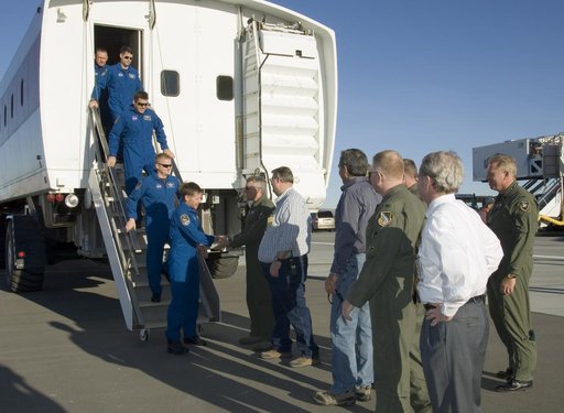 Air Force and NASA officials greet the STS-126 crew as they exit the Crew Transport Vehicle after landing the shuttle Endeavour at Edwards Air Force Base