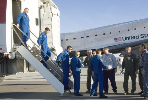 Air Force and NASA officials greet the STS-126 crew as they exit the Crew Transport Vehicle after landing the shuttle Endeavour at Edwards Air Force Base