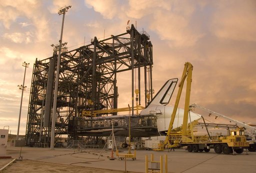 Puffy pink clouds form a canopy over the Space Shuttle Endeavour as processing continues in the Mate-Demate Device at NASA's Dryden Flight Research Center