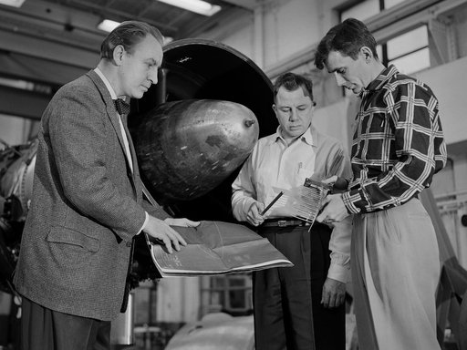 NACA Lewis Researcher and Technicians Discuss a Test Setup