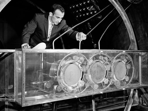 Engineer Examines Cluster of Ion Engines in the Electric Propulsion Laboratory