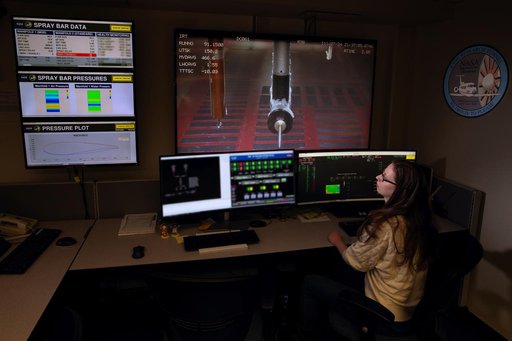 Carolyn Thiemann works on the Cobra data system in the IRT control room