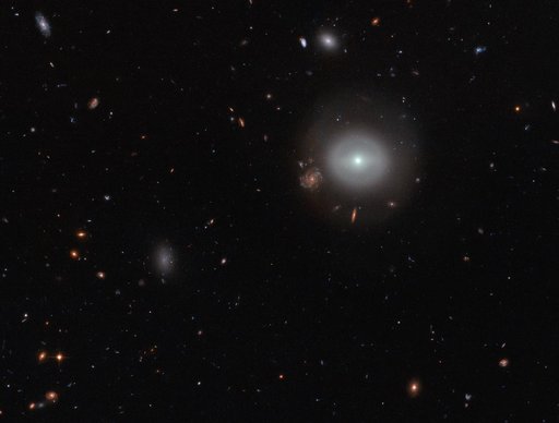 Hubble Finds a Lenticular Galaxy Standing Out in the Crowd