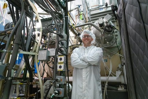 OCI Technician Monitors the Thermal Vacuum Chamber