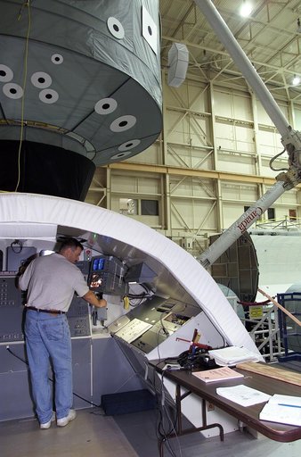 Views of STS-106 Pilot Scott Altman training with the RMS arm