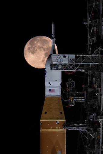 Full Moon Setting Behind Full Artemis II Stack at Launch Pad 39B