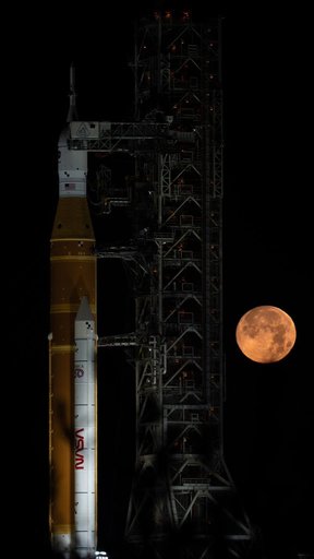 Full Moon Rising Over Full Artemis II Stack at Launch Pad 39B