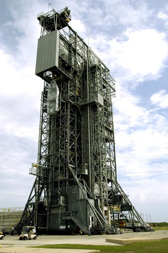 KENNEDY SPACE CENTER, FLA. -  At Launch Complex 17-A, Cape Canaveral Air Force Station, the second half of the fairing for the Mars Exploration Rover 2 (MER-2/MER-A) nears the top of the launch tower.  The fairing will be installed around the payload for protection during launch on a Delta II rocket