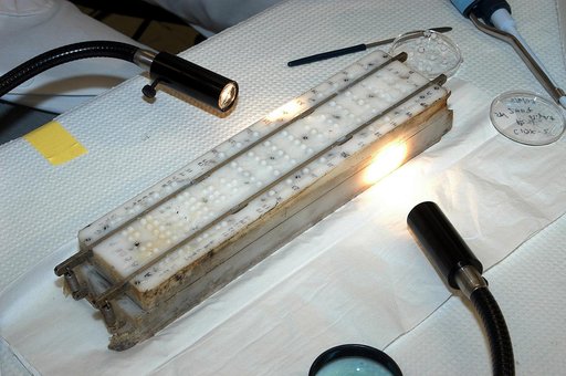 KENNEDY SPACE CENTER, FLA. - The apparatus shown was designed to hold microcapsules for research on mission STS-107.  It is one over several  included in the Commercial ITA Biomedical Experiments payload.  The box was recently recovered during the search for Columbia debris.  The drug delivery syste
