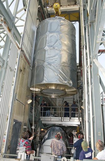 KENNEDY SPACE CENTER, FLA. - On Launch Complex 17-B, Cape Canaveral Air Force Station, the Space Infrared Telescope Facility (SIRTF) observatory is moved toward the outside of the launch tower.  It will be lowered and taken back to NASA Spacecraft Hangar AE. SIRTF will remain in the clean room at Ha