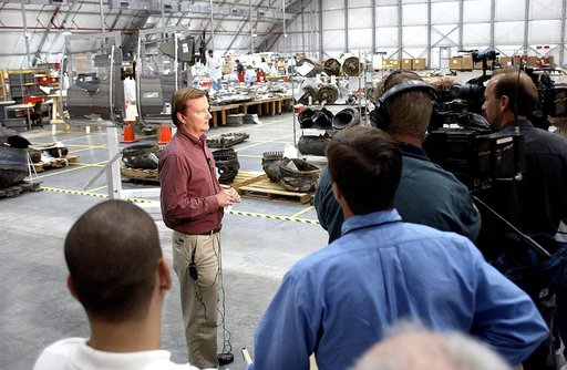 KENNEDY SPACE CENTER, FLA. - Shuttle Launch Director Mike Leinbach talks to the media in the RLV Hangar, site of the collection of Columbia debris undergoing examination.  The items shipped to KSC number more than 82,000 and weigh 84,800 pounds or 38 percent of the total dry weight of Columbia.  Of 