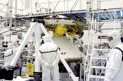 KENNEDY SPACE CENTER, FLA. -  The Mars Exploration Rover 2 (MER-2) entry vehicle (below) is being mated to the cruise stage (above).   The cruise stage includes fuel tanks, thruster clusters and avionics for steering and propulsion.  NASA's twin Mars Exploration Rovers are designed to study the hist