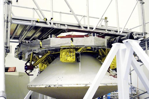 KENNEDY SPACE CENTER, FLA. - In the  Payload Hazardous Servicing Facility, the cruise stage is mated to the Mars Exploration Rover 2 (MER-2) entry vehicle.    The cruise stage includes fuel tanks, thruster clusters and avionics for steering and propulsion.  NASA's twin Mars Exploration Rovers are de