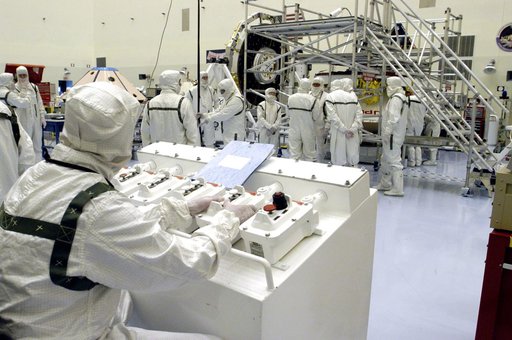 KENNEDY SPACE CENTER, FLA. - Workers in the Payload Hazardous Servicing Facility are preparing to determine weight and center of gravity for the Mars Exploration Rover 2 (MER-2).  NASA's twin Mars Exploration Rovers are designed to study the history of water on Mars. These robotic geologists are equ