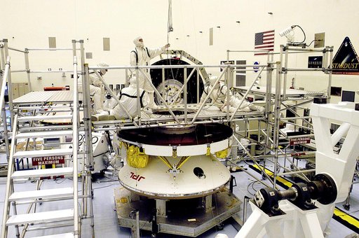 KENNEDY SPACE CENTER, FLA. - Workers in the Payload Hazardous Servicing Facility prepare the Mars Exploration Rover 2 (MER-2) for a weight and center of gravity determination.  NASA's twin Mars Exploration Rovers are designed to study the history of water on Mars. These robotic geologists are equipp