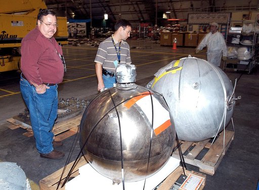 KENNEDY SPACE CENTER, FLA. -  Members of the Columbia Reconstruction Project Team examine pieces of debris in the RLV Hangar. The items shipped to KSC number more than 82,000 and weigh 84,800 pounds or 38 percent of the total dry weight of Columbia. Of those items, 78,760 have been identified, with 