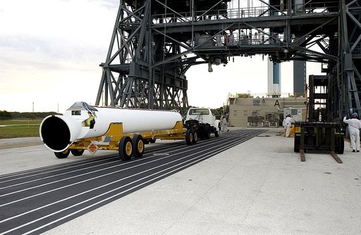 KENNEDY SPACE CENTER, FLA. - On Launch Complex 17-A, Cape Canaveral Air Force Station, a solid rocket booster is moved into position to raise to vertical and lift up the launch tower.  It is one of nine that will be mated to the Delta rocket to launch Mars Exploration Rover 2. NASA’s twin Mars Explo