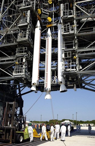 KENNEDY SPACE CENTER, FLA. - A third solid rocket booster (SRB) joins the first two in the launch tower  on Launch Complex 17-A, Cape Canaveral Air Force Station.  They are three of nine SRBs that will be mated to the Delta rocket to launch Mars Exploration Rover 2. NASA’s twin Mars Exploration Rove