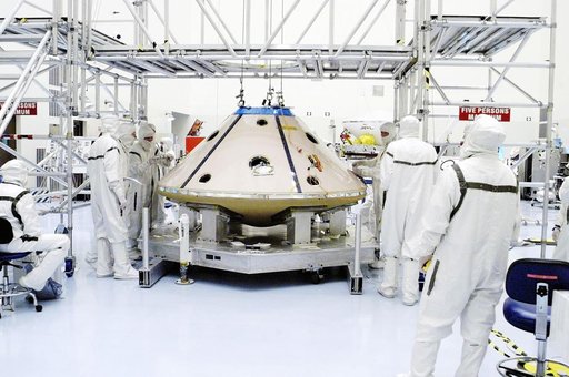 KENNEDY SPACE CENTER, FLA. -  Assembly of the backshell and heat shield surrounding the Mars Exploration Rover 1 (MER-1) is complete.  The resulting aeroshell will protect the rover on its journey to Mars.  NASA's twin Mars Exploration Rovers are designed to study the history of water on Mars. These