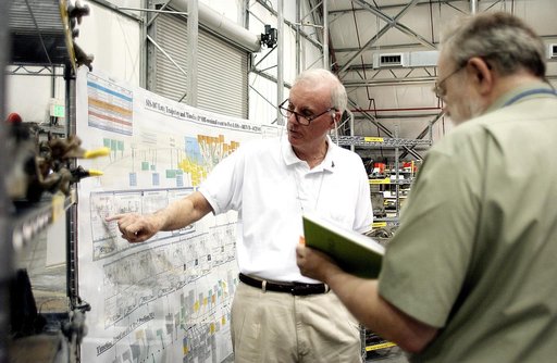 KENNEDY SPACE CENTER, FLA. - In the RLV Hangar, Adm. Harold Gehman, chairman of the Columbia Investigation Accident Board, points to data on a chart.  He and other board members are visiting as part of the ongoing investigation.  Recovery efforts as of May 5 included 82,500 pieces of debris weighing