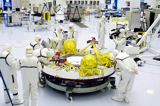 KENNEDY SPACE CENTER, FLA. - Technicians in the Payload Hazardous Servicing Facility prepare the cruise stage for Mars Exploration Rover 1 (MER-1) for integration with the aeroshell, the entry vehicle.   NASA’s twin Mars Exploration Rovers are designed to study the history of water on Mars. These ro