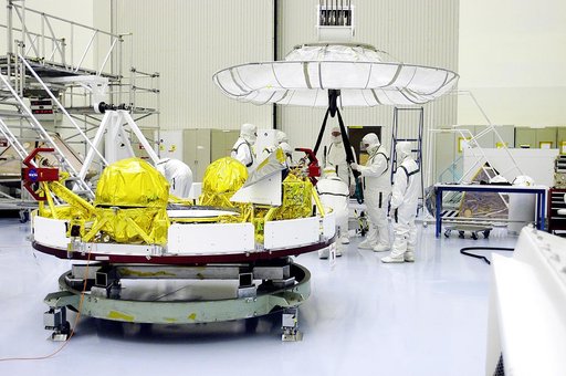 KENNEDY SPACE CENTER, FLA. -  Workers in the Payload Hazardous Servicing Facility prepare an overhead crane (background) that will lift the cruise stage, in the foreground, for Mars Exploration Rover 1 (MER-1).  The cruise stage will be moved and integrated with the aeroshell, the entry vehicle.   N