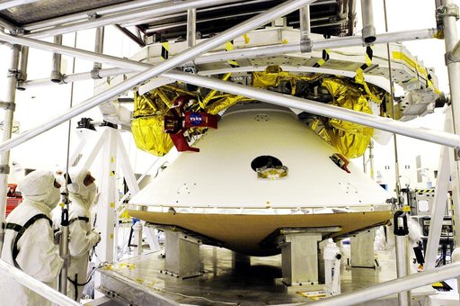 KENNEDY SPACE CENTER, FLA. - The Mars Exploration Rover 1 (MER-1) lander  (below) is mated to the cruise stage, seen above the lander.  NASA's twin Mars Exploration Rovers are designed to study the history of water on Mars. These robotic geologists are equipped with a robotic arm, a drilling tool, t