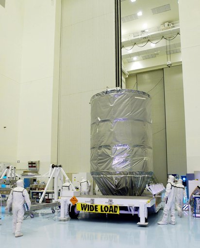 KENNEDY SPACE CENTER, FLA. - The Delta II rocket’s third stage rolls into the Payload Hazardous Servicing Facility.  It will be mated with the Mars Exploration Rover 2 (MER-2) and then installed into the transportation canister for transfer to the launch pad.  NASA's twin Mars Exploration Rovers are