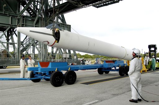 KENNEDY SPACE CENTER, FLA. - On Launch Complex 17-B, Cape Canaveral Air Force Station, a solid rocket booster is raised off  its transporter to lift it to vertical.  It will be mated to the Delta II rocket for the Mars Exploration Rover 1 (MER-1) launch June 25.  NASA’s twin Mars Exploration Rovers 