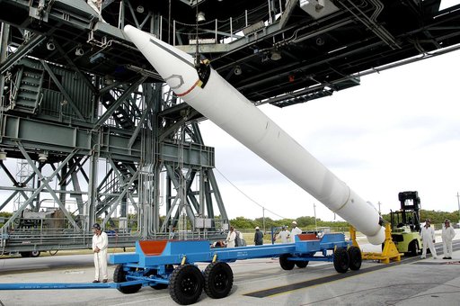 KENNEDY SPACE CENTER, FLA. - On Launch Complex 17-B, Cape Canaveral Air Force Station, a solid rocket booster is raised off  its transporter to lift it to vertical.  It will be mated to the Delta II rocket for the Mars Exploration Rover 1 (MER-1) launch June 25.  NASA’s twin Mars Exploration Rovers 