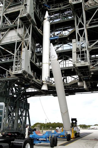 KENNEDY SPACE CENTER, FLA. - Another solid rocket booster is raised to vertical on Launch Complex 17-B, Cape Canaveral Air Force Station.  It is the second of nine SRBs that will be mated to the Delta II rocket for the Mars Exploration Rover 1 (MER-1) launch June 25.  NASA’s twin Mars Exploration Ro