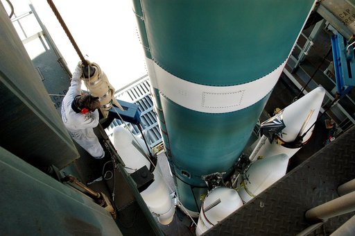 KENNEDY SPACE CENTER, FLA. - On the launch tower of Launch Complex 17-B, Cape Canaveral Air Force Station, solid rocket boosters are mated to the Delta II rocket for the Mars Exploration Rover 1 (MER-1) launch June 25.  NASA’s twin Mars Exploration Rovers are designed to study the history of water o