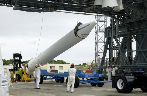 KENNEDY SPACE CENTER, FLA. -  On Launch Complex 17-B, Cape Canaveral Air Force Station, a solid rocket booster is raised off  its transporter to lift it to vertical.  It will be mated to the Delta II rocket for the Mars Exploration Rover 1 (MER-1) launch June 25.  NASA’s twin Mars Exploration Rovers