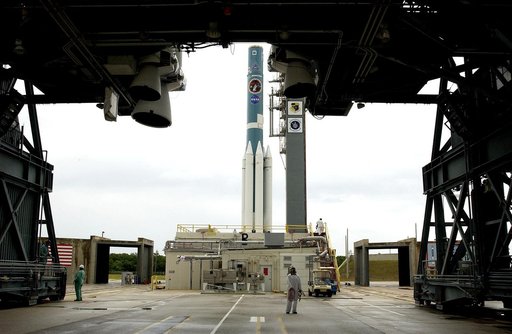 KENNEDY SPACE CENTER, FLA. -  Solid rocket boosters are positioned around the base of a Delta II rocket for the Mars Exploration Rover 1 (MER-1) launch on June 25 at Launch Complex 17-B, Cape Canaveral Air Force Station.  NASA’s twin Mars Exploration Rovers are designed to study the history of water