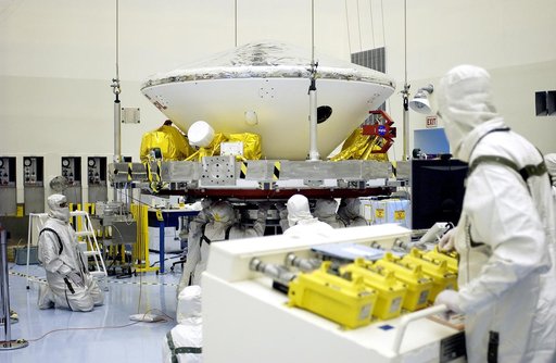 KENNEDY SPACE CENTER, FLA. -  In the Payload Hazardous Servicing Facility, workers prepare to mate the Mars Exploration Rover-2 (MER-2) to the third stage of a Delta II rocket for launch on June 5.  NASA’s twin Mars Exploration Rovers are designed to study the history of water on Mars. These robotic
