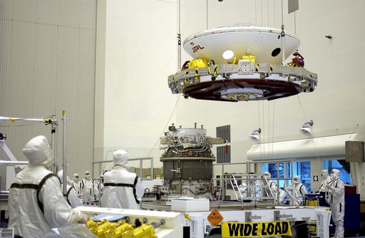 KENNEDY SPACE CENTER, FLA. -  In the Payload Hazardous Servicing Facility, workers prepare to mate the Mars Exploration Rover-2 (MER-2) to the third stage of a Delta II rocket for launch on June 5.  NASA’s twin Mars Exploration Rovers are designed to study the history of water on Mars. These robotic