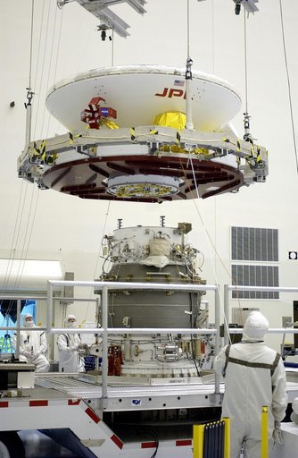 KENNEDY SPACE CENTER, FLA. -  In the Payload Hazardous Servicing Facility, workers prepare to mate the Mars Exploration Rover-2 (MER-2) to the third stage of a Delta II rocket for launch on June 5.  NASA’s twin Mars Exploration Rovers are designed to study the history of water on Mars. These robotic