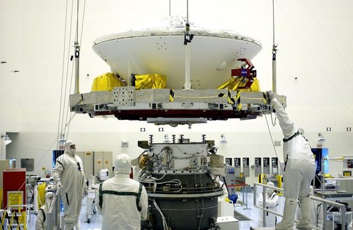 KENNEDY SPACE CENTER, FLA. -  In the Payload Hazardous Servicing Facility, workers prepare to mate the Mars Exploration Rover-2 (MER-2) to the third stage of a Delta II rocket for launch on June 5.  NASA’s twin Mars Exploration Rovers are designed to study the history of water on Mars. These robotic