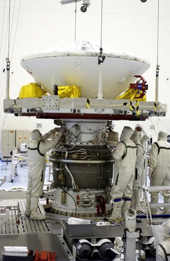 KENNEDY SPACE CENTER, FLA. -  In the Payload Hazardous Servicing Facility, workers mate the Mars Exploration Rover-2 (MER-2) to the third stage of a Delta II rocket for launch on June 5.  NASA’s twin Mars Exploration Rovers are designed to study the history of water on Mars. These robotic geologists