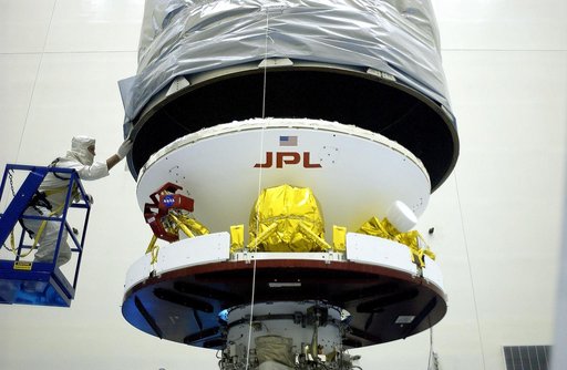 KENNEDY SPACE CENTER, FLA. -  In the Payload Hazardous Servicing Facility, the Mars Exploration Rover 2 (MER-2) is being encapsulated for transfer to Launch Complex 17-A, Cape Canaveral Air Force Station.  MER-2 is one of NASA's twin Mars Exploration Rovers designed to study the history of water on 