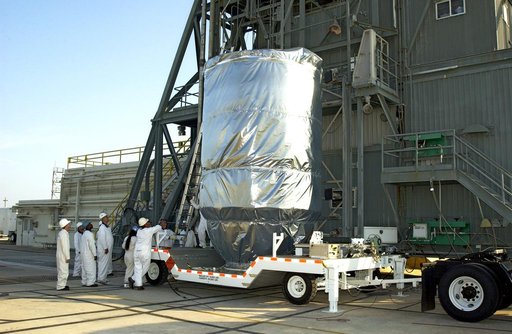 KENNEDY SPACE CENTER, FLA. - The Mars Exploration Rover 2 (MER-2), inside the transport canister, will be lifted up the launch tower on Launch Pad 17-A, Cape Canaveral Air Force Station, where it will be mated to the Delta II rocket for launch.  MER-2 is one of NASA's twin Mars Exploration Rovers de