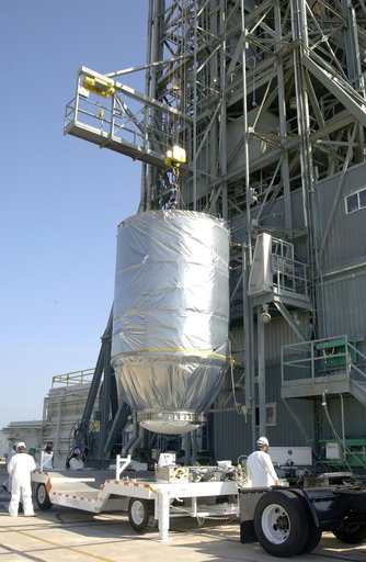 KENNEDY SPACE CENTER, FLA. - On Launch Pad 17-A, Cape Canaveral Air Force Station, the Mars Exploration Rover 2 (MER-2), inside the transport canister, is lifted off the transporter and into the launch tower where it will be mated to the Delta II rocket for launch.  MER-2 is one of NASA's twin Mars 