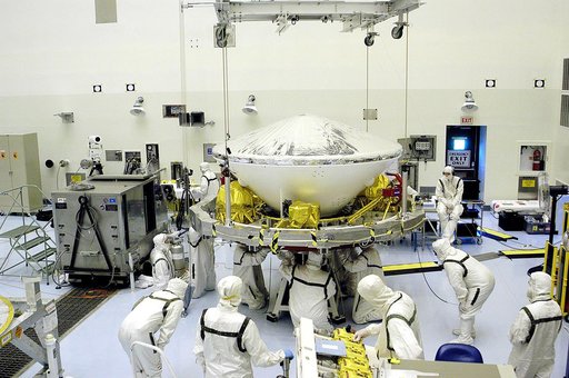KENNEDY SPACE CENTER, FLA. - In the Payload Hazardous Servicing Facility, workers prepare to lift the Mars Exploration Rover-1 (MER-B) onto a spin table during preflight processing of the spacecraft.  The rover is scheduled to launch aboard a Delta II rocket on June 25.  NASA’s twin Mars Exploration