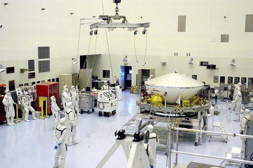 KENNEDY SPACE CENTER, FLA. - In the Payload Hazardous Servicing Facility, workers prepare to lift the Mars Exploration Rover-1 (MER-B) onto a spin table during preflight processing of the spacecraft.  The rover is scheduled to launch aboard a Delta II rocket on June 25.  NASA’s twin Mars Exploration
